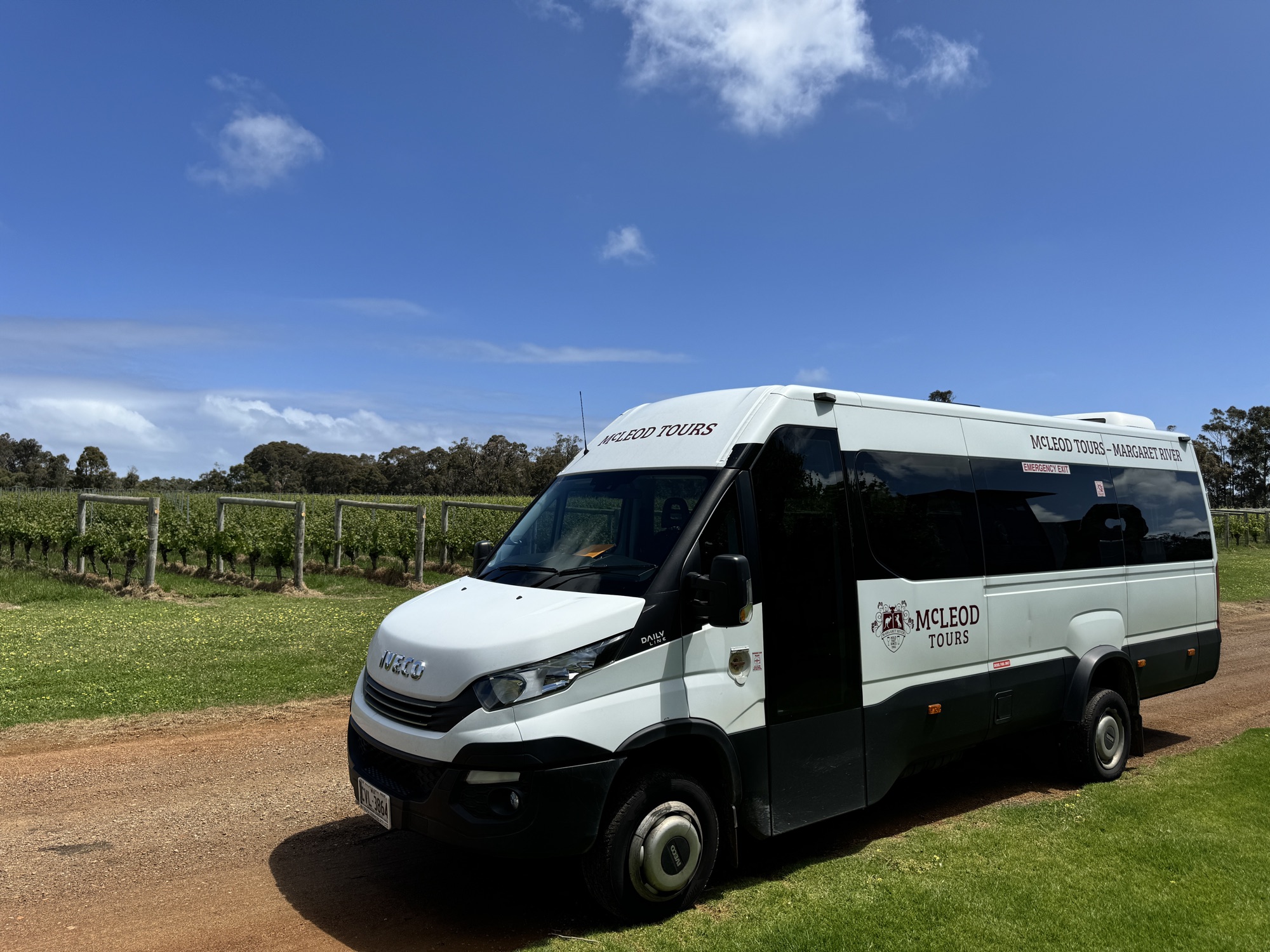 The Iveco Daily parked on a gravel track beside a Margaret River vineyard