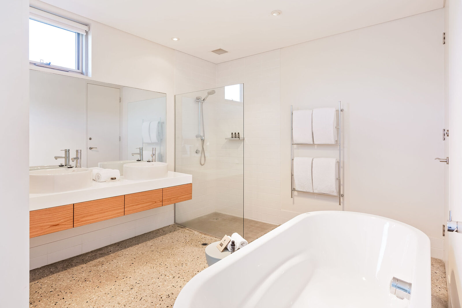 The ensuite: twin vanity, walk-in shower and a freestanding bath